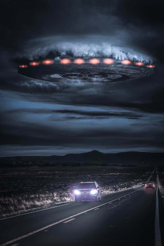 alien spaceship breaking through the clouds over a desert highway USED FOR The Mojave UFO Incident by the Black Cat Report